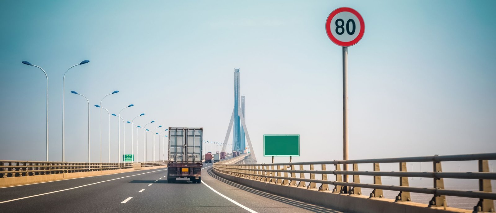 Truck on the Nakuru–Nairobi highway with a live tracking status card