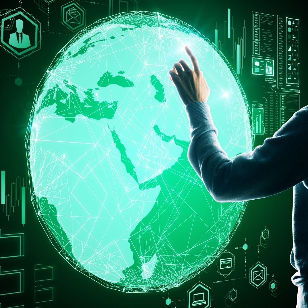 Hand reaching towards a glowing digital globe