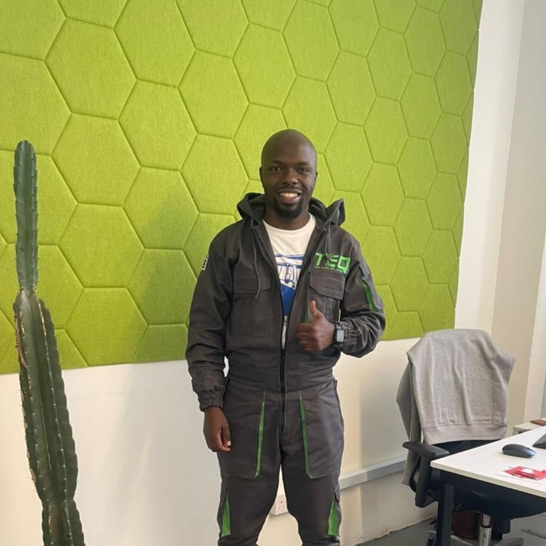 Technician in work overalls